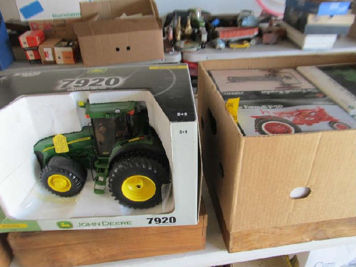 Large group of boxed farm toys.  All to be sold at 50% of marked price