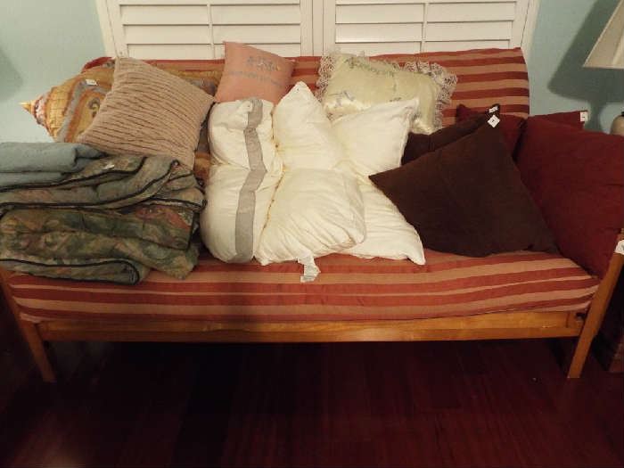 Nice futon full of linens