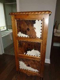 3 of these handmade bedroom pieces made with cowhide and have horse head pulls