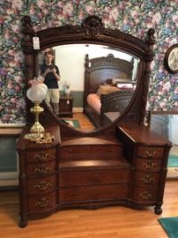 3 piece suite of ornately decorated mahogany bedroom furniture,  
