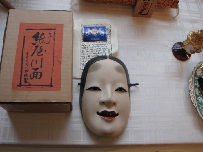 Chinese mask with box and papers