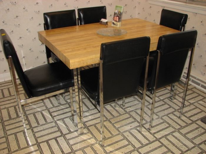 butcher block style table, leather and chrome chairs