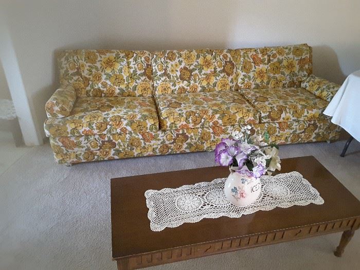 Vintage flowered yellow couch, 8 feet long, very comfortable, good for dormitory, college, romper room, setting up a new apartment, for basement, large workout and play rooms. Sturdy couch, in lovely condition. 