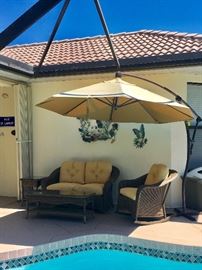Faux wicker seating and extended umbrella