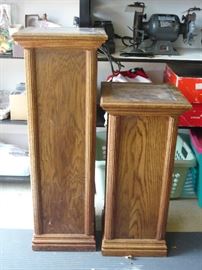 Two oak pedestals, lucite tops, one with light inside