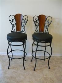 Wrought iron and cherrywood swivel bar stools
