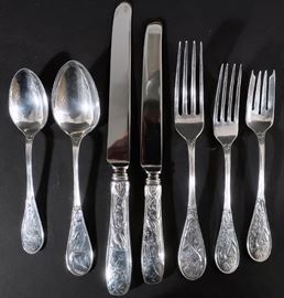 Tiffany "Audubon Birds" Sterling Silver Flatware, 20th C., the pattern designed in 1871 by Edward C. Moore (1827-1891), no monograms, service for 19 including dinner and luncheon forks, dinner and luncheon knives, soup spoons and teaspoons; together
with 5 butter knives, 6 demitasse spoons, 8 salad forks. Also included are 3 sugar spoons, 2 serving spoons, 2 serving forks, 1 cold meat fork. 1 cheese knife, 3 gravy ladles, 2 sauce ladles, 3 pie servers, carving knife and fork.  (222 ozt., weighable silver)