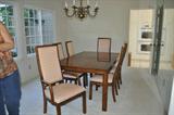 Henredon dining table with large leaf, six chairs, custom padded cover, beautiful condition