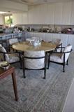 Round dining table with 6 chairs. 9" x 12" rug. 5 Mid century modern brushed aluminum counter chairs.