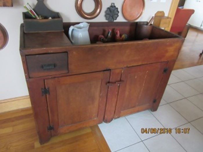 Pine dry sink is a 19th C piece with cast iron handles and hinges. 
