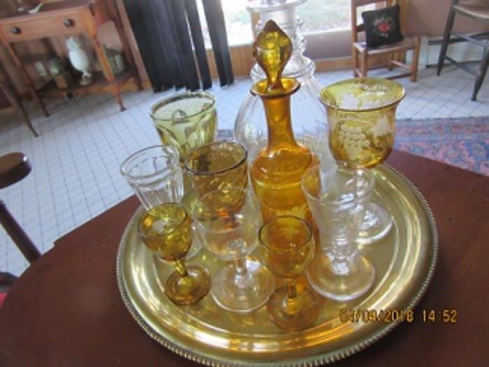 Some of the amber pieces in this home.  The early clear decanter in the back is 19th C. 