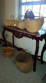 Marbletop Cherry Console table shown with hand crafted baskets