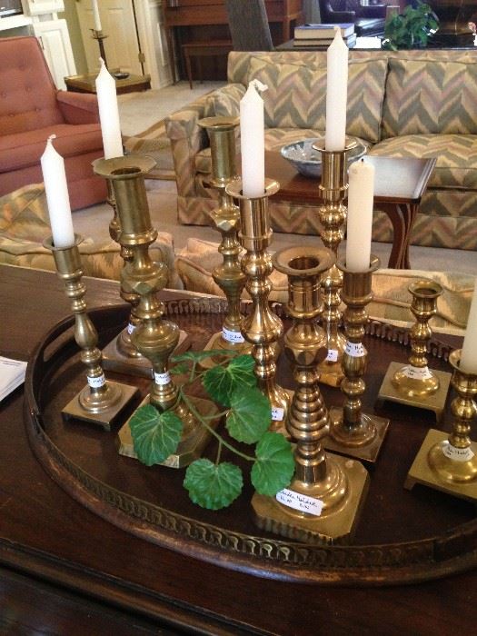 Great variety of brass candle holders