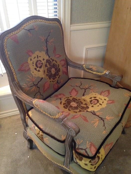 One of two beautifully upholstered arm chairs