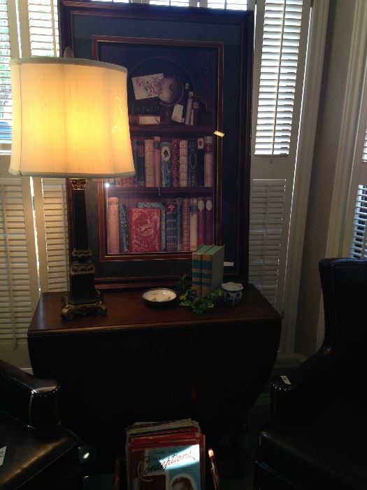 One of the many great lamps; drop leaf table; library books framed art.