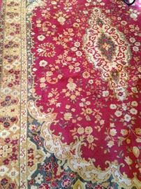 5 feet 10 inches x eight feet 5 inches rug in red and gold