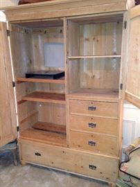 Fabulous pine entertainment center with lots of storage.
