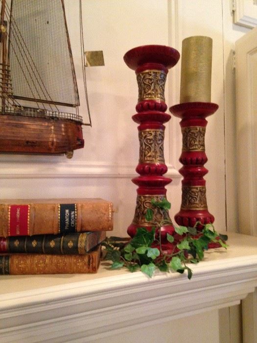 Old books and colorful candlesticks
