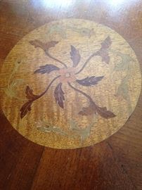 Top of the side table with inlaid wood