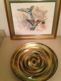 Swirled bowl in gold, green, and brown; framed bird art