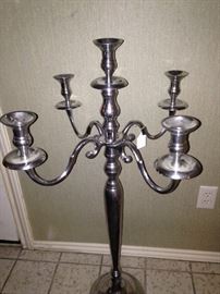Tall silver colored candelabra
