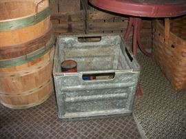 metal crate, red table, bushel baskets