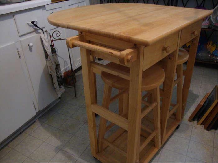 Drop Leaf, Rolling Island with two concealed Bar stools....How cool is that?