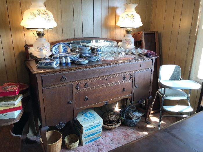 Vintage buffet, Blue Willow dishes, Hurricane lamps, Assorted Crystal, boxed snack sets, Vintage high chair. 
