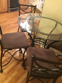 Iron and glass cafe table with 4 chairs 24 inches tall $350