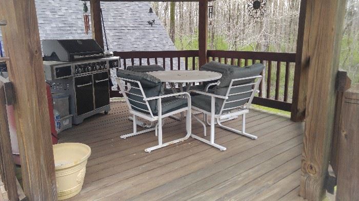 Metal outdoor table and chairs with cushions