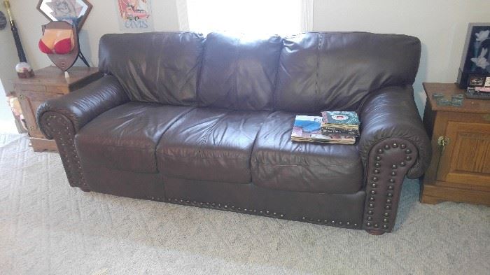 All leather Man cave couch up in the man cave above the garage