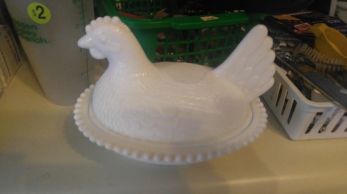 Milk glass hen on a basket