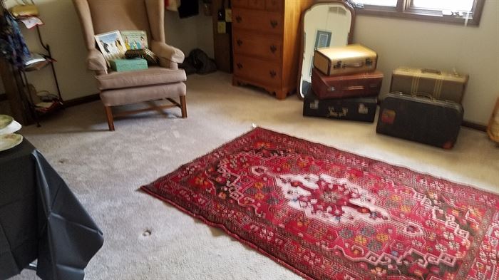 vintage luggage and oriental rug
