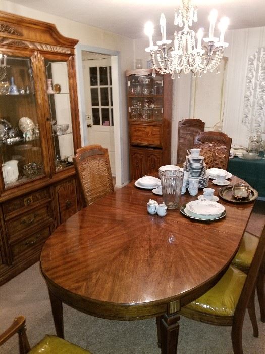 Solid dining room set with extra leafs and pads... glass chandler is also for sale