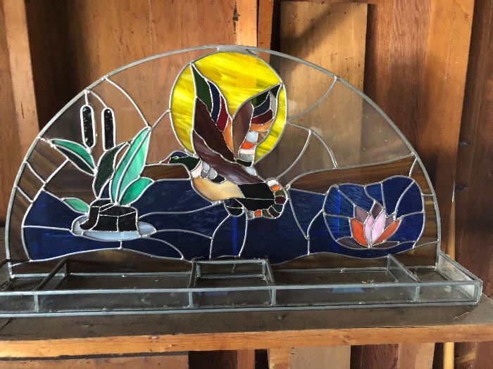 This stain glass piece looks great on a patio area or table
