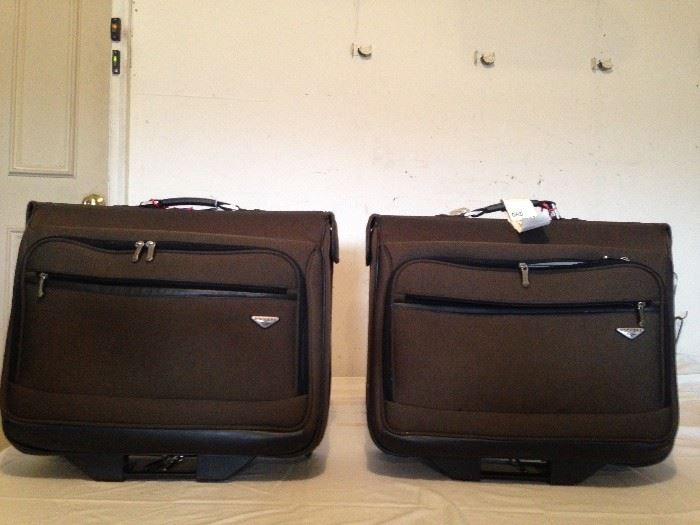 2 Large suit cases on wheels w/handles