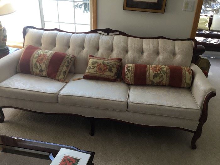 French Provincial style sofa with white brocade covering. Excellent condition