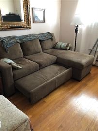 Small Sectional with foot rest & storage, opens up to a bed! 