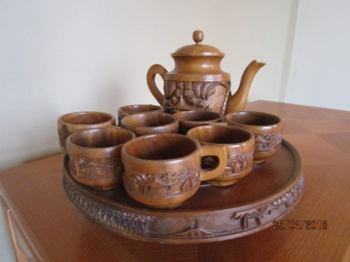 Vintage carved Tiki tea set on carousel