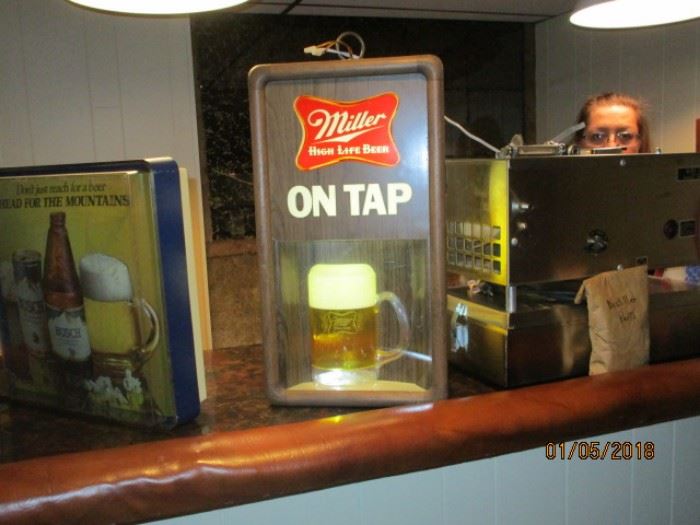 One of several lighted beer signs