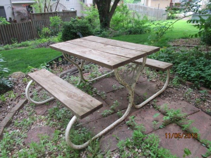 Picnic table with attached benches