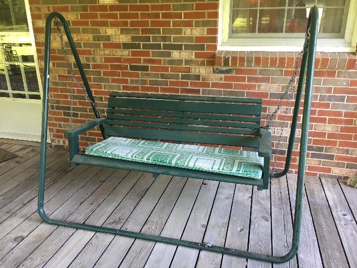 Outdoor patio swing on metal frame.