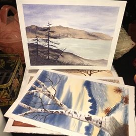 Several unsigned and unframed watercolor landscapes.