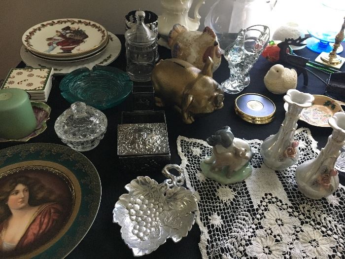 Tables full of kitchen and household items, decor, china and glassware.