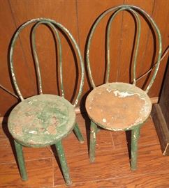 These incredible Antique Steel little childs chairs.