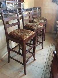 exquisitely carved set of four hand crafted bar stools from Pakistan 