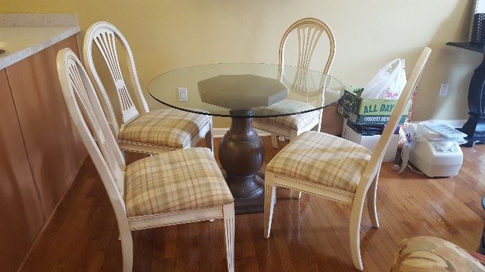$60   Round, glass table with brown pedestal  measures 42"   White chairs with plaid seats  $60 all four
