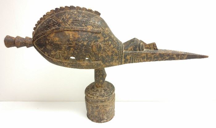 Large Baga Guinea, West Africa A-Tshol Anok or Nok Bird Headdress Helmet Mask Statue

Carved wood with dark patina.

16.5" high x 25.75" wide overall including circular post plinth base stand (mask helmet head itself is 7.5" high and 3.75" deep, base itself is 10.25" high with a 4.25" base diameter and a 1" top diameter). 

Provenance: Discovered in Africa then transported back to Nevada, USA by safari photographer Jeanne Drake; Drake estate sale, Nevada; Nevada collector.