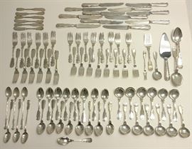 US State Dept Fiddle Thread 87pc Flatware Set
An 87 piece set of Fiddle Thread pattern Colonial Georgian Revival 20th century fiddle back motif sterling .925 silver flatware by the Frank W. Smith Silver Company of Gardner, Massachusetts that was according to the present owner ordered as a professional courtesy by the U.S. State Department and re-sold to him at cost.
Approx. 101.5ozt (approx. 95ozt solid sterling silver + 13 hollow handled pcs. at approx. 0.5ozt silver portion of weight ea.) variously in numbers of 6s, 12s and 16s plus five serving pieces and one additional badly damaged teaspoon. No monograms. Each solid piece with Smith lion rampant and S cojoined hallmark and marked STERLING, hollow handles marked STERLING, knife blades marked STEEL BLADE SILVER PLATED, pie server blade marked STAINLESS.
Provenance:
Private collection of a retired manager of a well known Dupont Circle, Washington, D.C. business whose clients included the National Gallery of Art and the State Dept.