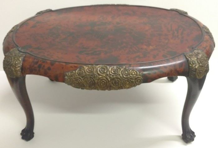 Maison Franck Carved Mahogany, Giltwood and Shell Inlay Belgian Oval Coffee Table: Stamped FRANCK FRERES, 12 Exemplaires and stenciled 32906 with faint paper label remnant adjacent to stamp.

This appears to be one of the 12 from the same edition of examples of which one was offered in France on artnet in 2009:

Maison Franck
Table basse ovale
Tinted mahogany and tortoiseshell marquetry
Circa 1925
Height 19.7 in.; Width 39.4 in.; Depth 29.5 in. - Height 50 cm.; Width 100 cm.; Depth 75 cm.
Edition 12
Stamped
Claude Aguttes: Wednesday, May 6, 2009 [Lot 00052]Arts Décoratifs du XXe siècle

The table is accompanied by a glass top that conforms to the molding shape and is 3/8" thick.